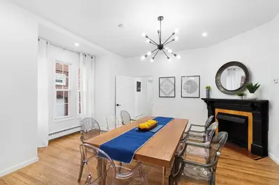 a dining room with a table and chairs at Montclair's Best Stays in Montclair