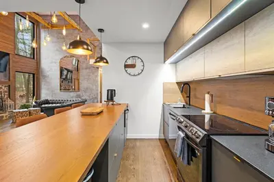 a kitchen with a wooden counter top in a room at Pine Breeze in Pocono Pines
