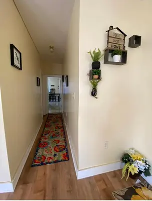 a hallway with a rug on the floor at Vibrant home all to yourself in Newark