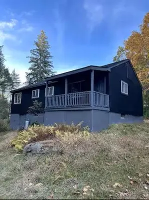 a black house on top of a hill at Modern 3-Bedroom Retreat with Fire Pit - Ski at Big Bear - Mountain Views in Eldred