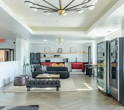 a living room with a couch and a kitchen at Sky-view 2BD Apartment In Northern Liberties in Philadelphia