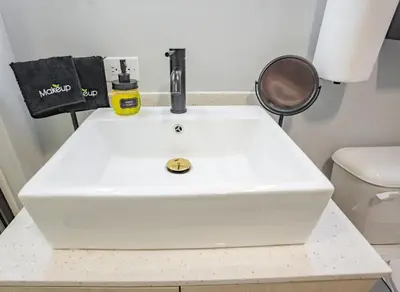 a white sink in a bathroom with a toilet at Sky-view 2BD Apartment In Northern Liberties in Philadelphia