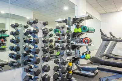 a gym with a rack ofhelmets and a treadmill at Sky-view 2BD Apartment In Northern Liberties in Philadelphia