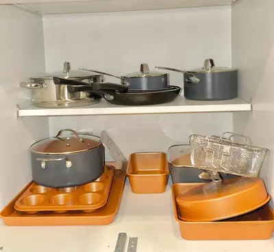a kitchen with several pots and pans on shelves at Sky-view 2BD Apartment In Northern Liberties in Philadelphia