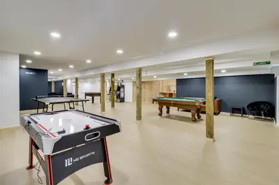a room with a pool table and ping pong tables at Hot Tub and Epic Game Room! Poconos Family Retreat in Blakeslee