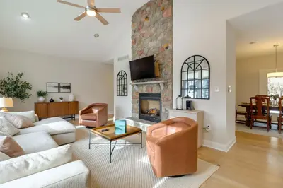 a living room with a couch and a fireplace at Walk to Big Boulder Mtn and Lake, Home with Hot Tub! in Lake Harmony