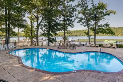 a swimming pool at a resort with a lake at Walk to Big Boulder Mtn and Lake, Home with Hot Tub! in Lake Harmony