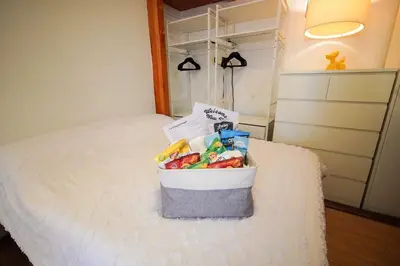 a basket of fruit sitting on top of a bed at Private Studio Near NYC - Easy Commute & Workspace in Guttenberg
