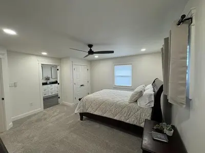 a bedroom with a bed and a ceiling fan at Farm Views - 10 min to Sight & Sound in Ronks