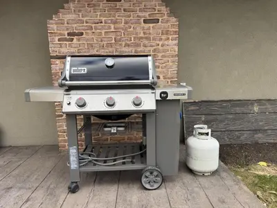 a grill on a cart next to a brick wall at Farm Views - 10 min to Sight & Sound in Ronks