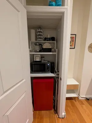 a kitchen with a microwave and a red refrigerator at The Midtown Sanctuary - Private Silent Suite at Times Square in New York