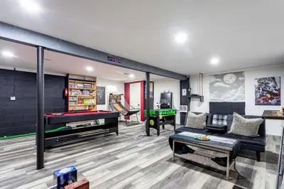 a living room with a pool table and ping pong ball at Summit Retreat Hot Tub Game Room Sauna in Tobyhanna