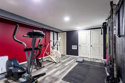 a fitness room with a gym with tread machines at Summit Retreat Hot Tub Game Room Sauna in Tobyhanna