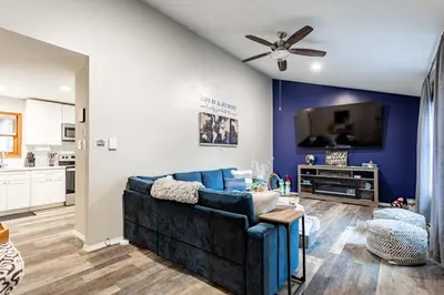 a living room with a couch and a tv at Summit Retreat Hot Tub Game Room Sauna in Tobyhanna