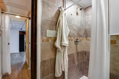 a bathroom with a shower and a shower curtain at Mtn-View Balcony! All-Season Apt Near Jim Thorpe in Nesquehoning