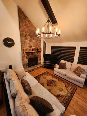 a living room with a couch and a fireplace at Pocono Ski Home Fire Pit Game Room EV in Tobyhanna