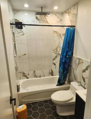 a bathroom with a tub and a toilet and a sink at Pocono Ski Home Fire Pit Game Room EV in Tobyhanna