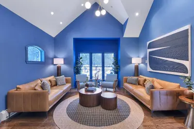 a living room with two couches and a table at Lux Retreat with Indoor Swim Spa Game Lounge Theater Hot Tub Sauna in Blakeslee