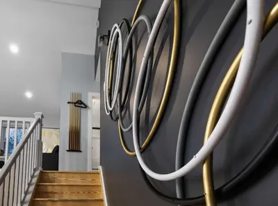 a wall with gold handles on a wall at Moon Mtn Manor Sleeps 16 Karaoke Hot Tub in Albrightsville