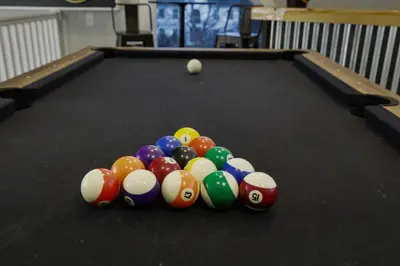 a group of billiard balls on a pool table at Moon Mtn Manor Sleeps 16 Karaoke Hot Tub in Albrightsville