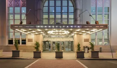 a building with a sign in front of it at Modern 2BR 8 mins to Penn Station with WiFi Laundry in Newark