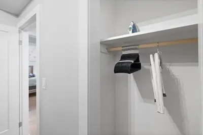 a bathroom with a sink and a mirror at Cozy and Modern 3BR Apartment 5min to PATH to NYC in Jersey City