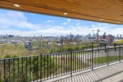 a balcony with a view of the city at Modern & Cozy Studio in Jersey 20 Min to New York in Jersey City