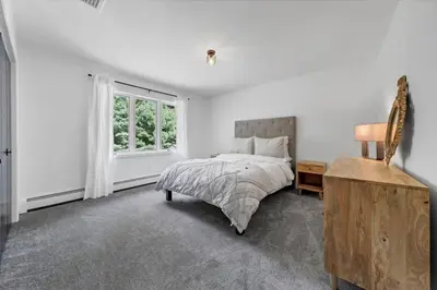 a white bedroom with a bed and a window at Mediterranean villa hot tub fire place•fire pit in Monroe