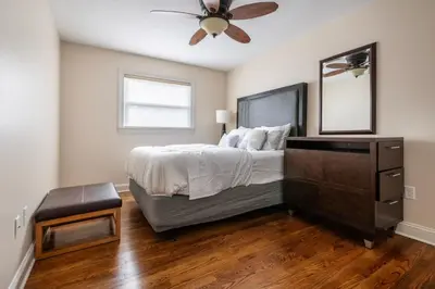 a bedroom with a bed and a ceiling fan at 5 Woods Dr in Mechanicsburg