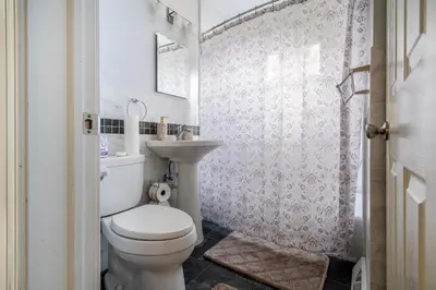 a bathroom with a toilet and a sink at 5 Woods Dr in Mechanicsburg