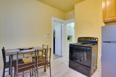 a kitchen with a stove and a refrigerator at 2 Mi to Rutgers University! Urban Hub Near Parks in Newark