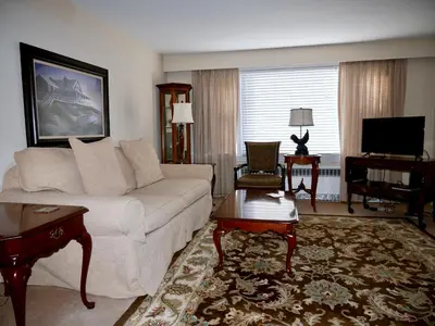 a living room with a couch and a tv at Turkey Hill Inn in Summit