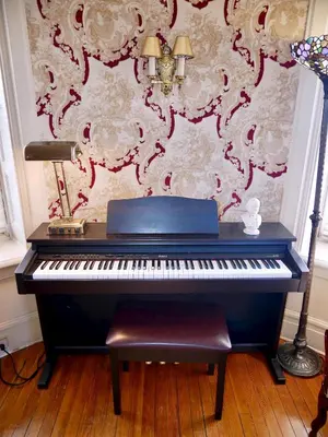 a blue piano sitting in a room with a wall at Turkey Hill Inn in Summit