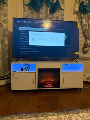 a tv sitting on top of a tv stand with a fireplace at Enjoyable 3-bedroom house in charming East Orange neighborhood in East Orange