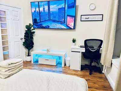 a bedroom with a desk and a chair and a desk and a desk at Ultra-Modern Luxury Room Executive Stay Near NYC in Paterson