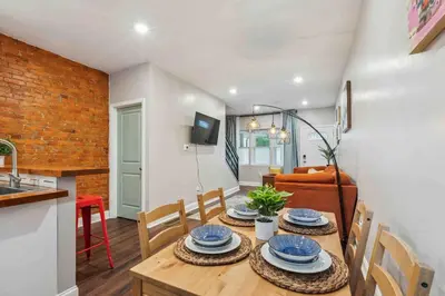 a kitchen and dining room with a table and chairs at 4BR Near HUP, CHOP, UPENN Free Parking 30 Days in Philadelphia