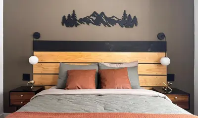 a bedroom with a large bed with a wooden headboard at Blackwood Cabin Pocono in Pocono Farms East