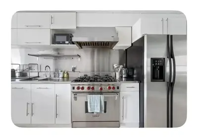 a kitchen with a stove and a refrigerator at Bright and spacious apt, W&D in unit - Monthly in New York