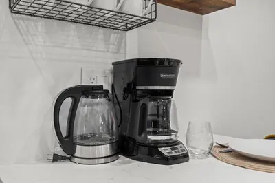 a coffeemaker sitting on a counter next to at Urban 1BR Apartment Near Center City & University City in Philadelphia