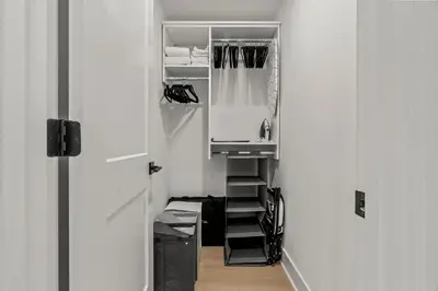 a closet with a sink and a mirror at Urban 1BR Apartment Near Center City & University City in Philadelphia