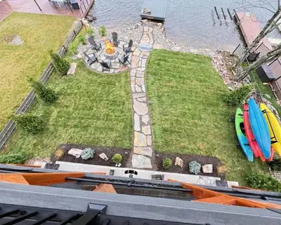 an aerial view of a yard with surfboards on it at 9 BR,34 Sleeps Skiing Lake Sauna Hottub Kayaks in Lake Harmony