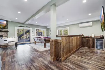 a large room with a pool table and a pool table at New Luxe! 9BR,7BA, Elevator, Sleeps 30, EV Charger in Lake Harmony