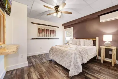 a bedroom with a bed and a ceiling fan at New Luxe! 9BR,7BA, Elevator, Sleeps 30, EV Charger in Lake Harmony