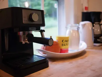 a coffee maker sitting on top of a counter with a drink at The Swiss Hill Farmhouse - 5 Bedrooms w Hot Tub in Jeffersonville