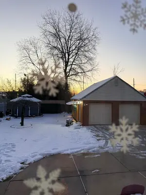 a house in a yard covered in snow at House For Rent Near MetLife Stadium in Hasbrouck Heights