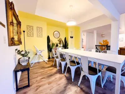 a dining room with a white table and chairs at PrivatePool|Hot tub|Sauna|HomeTheater|Backyard in Long Pond