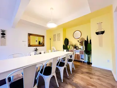 a dining room with a large white table and chairs at PrivatePool|Hot tub|Sauna|HomeTheater|Backyard in Long Pond