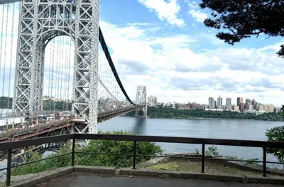 a bridge over a river with a city in the background at World Cup Stay Close to MetLife Stadium NYC in Waldwick