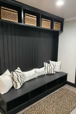 a black bench with pillows on it in a room at World Cup Stay Close to MetLife Stadium NYC in Waldwick