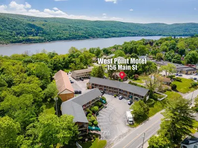 an aerial view of a west point motel with a river at West Point Motel in Highland Falls